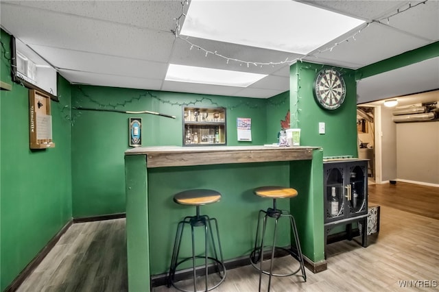 47 Acacia Dr, Amherst, NY 14228 - indoor dry bar with a paneled ceiling, wood finished floors, and baseboards