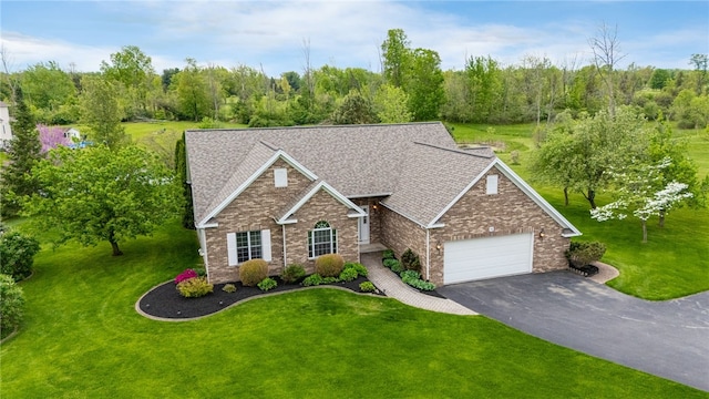 15 Stag Creek Trl, Clarkson, NY 14420 - traditional-style home featuring an attached garage, driveway, a front lawn, brick siding, and a shingled roof