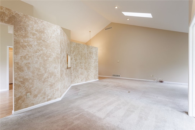 15 Stag Creek Trl, Clarkson, NY 14420 - empty room with a skylight, carpet floors, vaulted ceiling, and baseboards