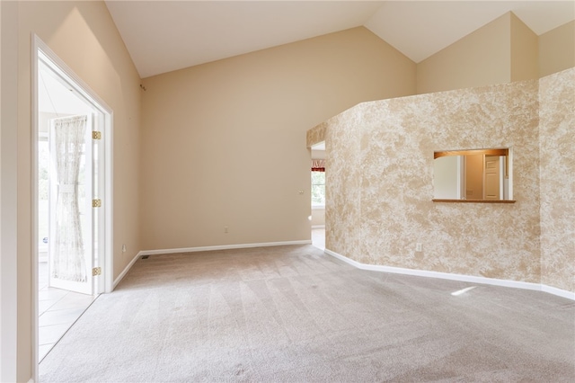 15 Stag Creek Trl, Clarkson, NY 14420 - spare room with vaulted ceiling, carpet, and baseboards