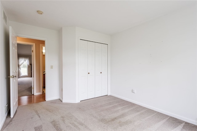 15 Stag Creek Trl, Clarkson, NY 14420 - unfurnished bedroom featuring carpet flooring, baseboards, and a closet