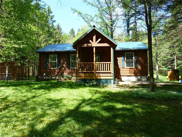 2693 Pulver Rd, Italy, NY 14418 - back of property featuring covered porch, faux log siding, a lawn, and metal roof
