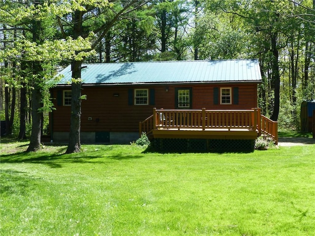 2693 Pulver Rd, Italy, NY 14418 - rear view of house with a deck, a yard, and metal roof