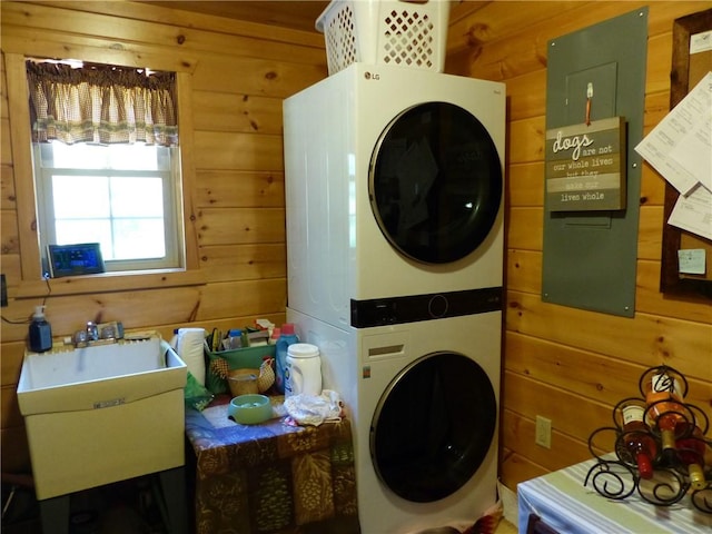 2693 Pulver Rd, Italy, NY 14418 - washroom with stacked washer / drying machine and wooden walls