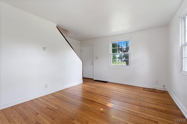 508 W Brighton Ave, Syracuse, NY 13205 - unfurnished living room with light wood-style flooring and baseboards