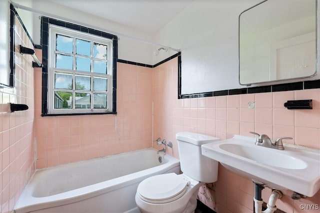 508 W Brighton Ave, Syracuse, NY 13205 - bathroom featuring toilet, tile walls, bathtub / shower combination, and a sink