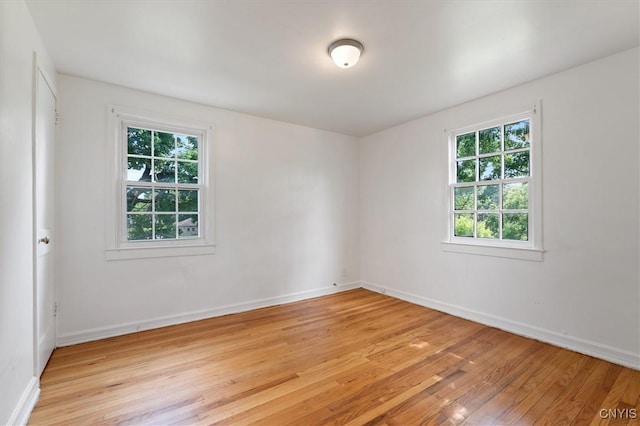 508 W Brighton Ave, Syracuse, NY 13205 - spare room featuring healthy amount of natural light, light wood-type flooring, and baseboards