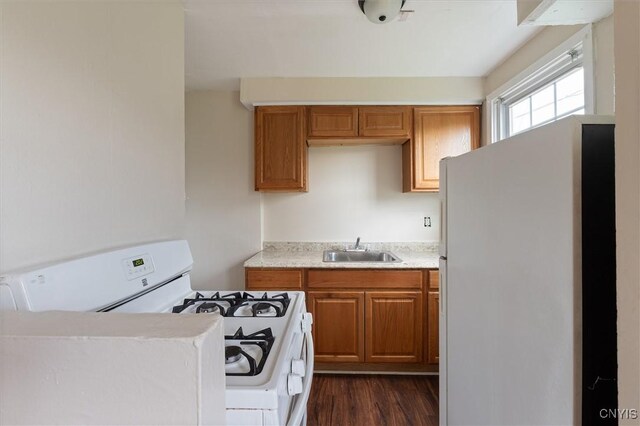 508 W Brighton Ave, Syracuse, NY 13205 - kitchen with white appliances, a sink, light countertops, dark wood-style floors, and brown cabinets