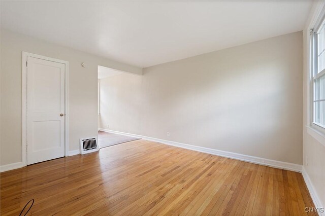 508 W Brighton Ave, Syracuse, NY 13205 - unfurnished room with light wood-type flooring, baseboards, and healthy amount of natural light