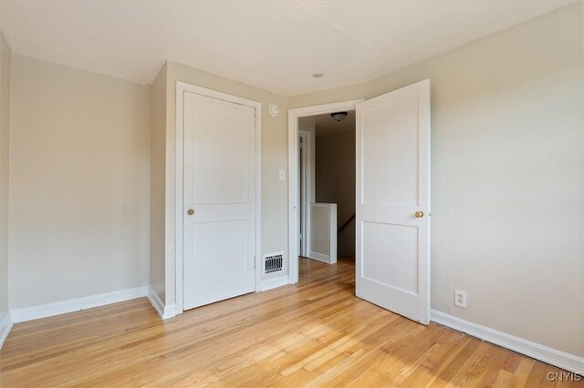 508 W Brighton Ave, Syracuse, NY 13205 - unfurnished bedroom featuring light wood-style flooring and baseboards