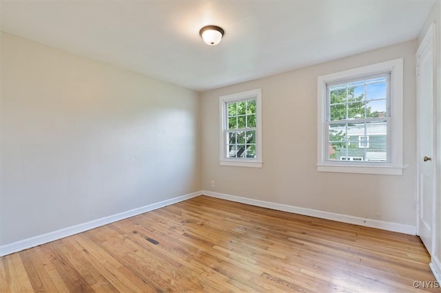 508 W Brighton Ave, Syracuse, NY 13205 - unfurnished room with light wood-type flooring, healthy amount of natural light, and baseboards