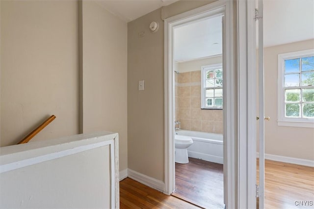 508 W Brighton Ave, Syracuse, NY 13205 - hall with wood finished floors, baseboards, and an upstairs landing