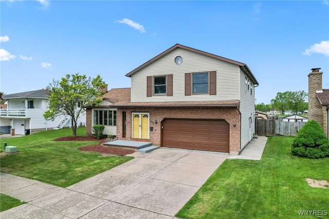 307 Wadsworth Ct, Tonawanda-City, NY 14150 - traditional-style house with brick siding, a garage, and driveway