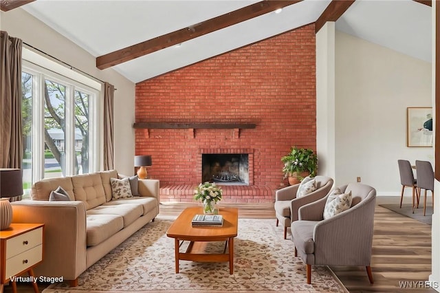307 Wadsworth Ct, Tonawanda-City, NY 14150 - living area featuring wood finished floors, beam ceiling, a brick fireplace, baseboards, and high vaulted ceiling