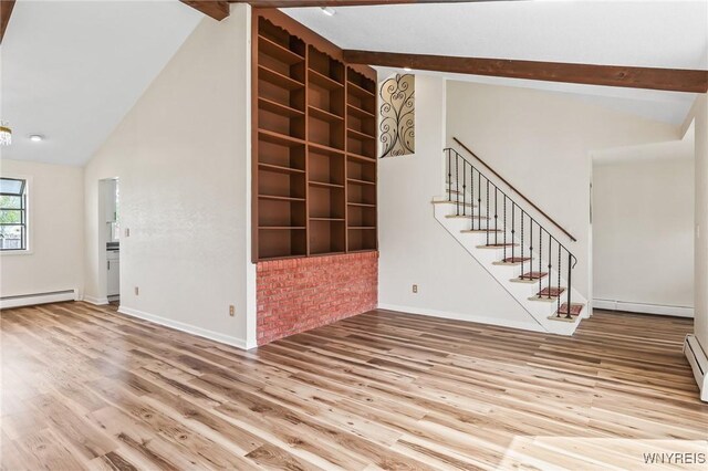 307 Wadsworth Ct, Tonawanda-City, NY 14150 - spare room featuring baseboard heating, wood finished floors, stairs, beam ceiling, and high vaulted ceiling