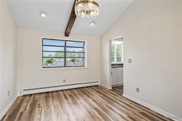 307 Wadsworth Ct, Tonawanda-City, NY 14150 - empty room featuring a baseboard heating unit, a chandelier, light wood-style flooring, and baseboards