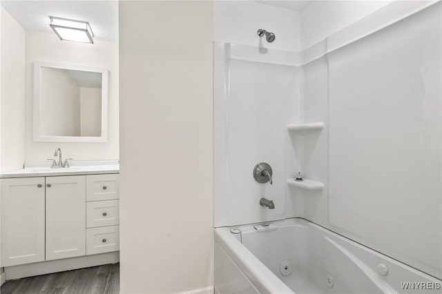 307 Wadsworth Ct, Tonawanda-City, NY 14150 - bathroom with wood finished floors, a combined bath / shower with jetted tub, and vanity