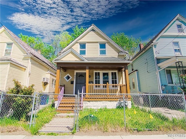 587 Goodyear Ave, Buffalo, NY 14211 - view of front of property with covered porch, a gate, a fenced front yard, and a shingled roof