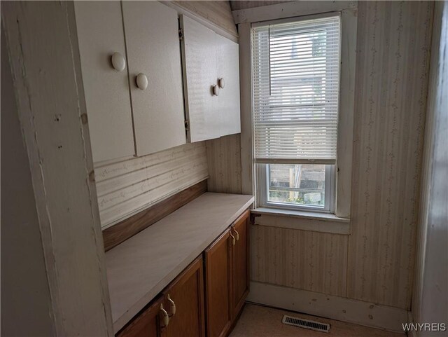 334 N 13th St, Olean-City, NY 14760 - kitchen with brown cabinetry and light countertops