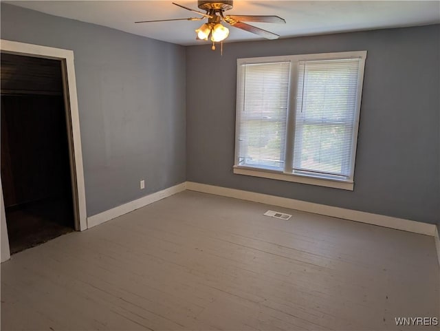 334 N 13th St, Olean-City, NY 14760 - unfurnished bedroom with wood finished floors, baseboards, and ceiling fan