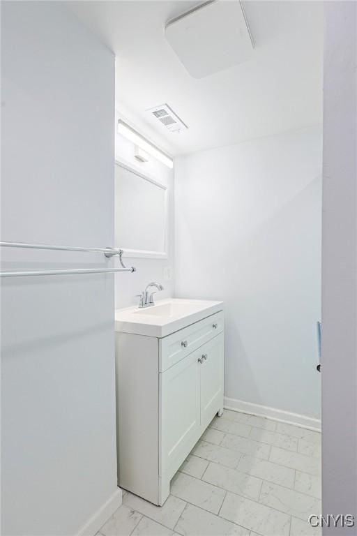 115 Matterson Ave, Camillus, NY 13219 - bathroom with marble look tiles, baseboards, and vanity