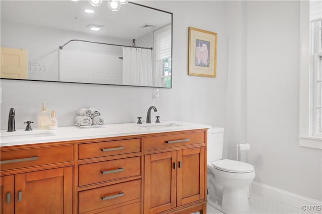 2875 W Lake Rd, Cazenovia, NY 13035 - full bathroom featuring toilet, double vanity, a shower with curtain, and baseboards
