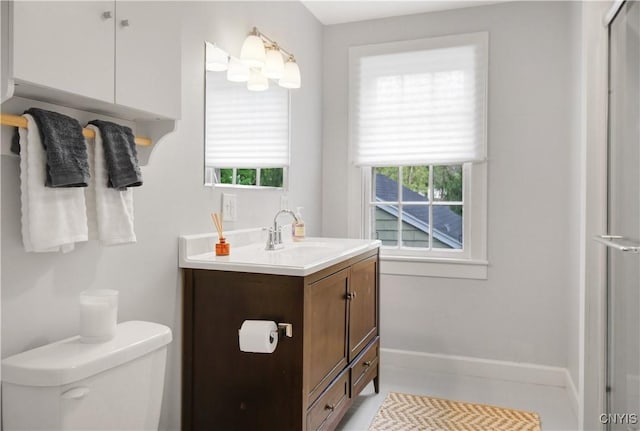 2875 W Lake Rd, Cazenovia, NY 13035 - bathroom with vanity, toilet, plenty of natural light, and baseboards