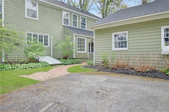 2875 W Lake Rd, Cazenovia, NY 13035 - back of house featuring a shingled roof and a patio