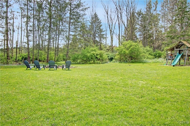 2875 W Lake Rd, Cazenovia, NY 13035 - view of green lawn featuring a playground