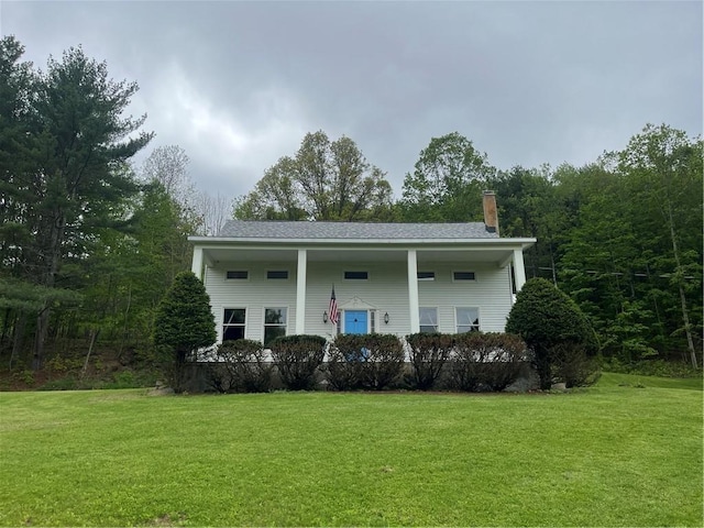 1217 County Highway 34, Westford, NY 12155 - view of front facade featuring a chimney and a front lawn