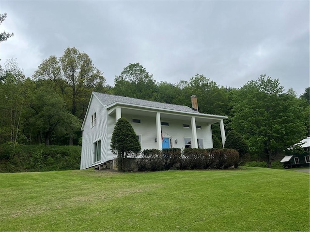 1217 County Highway 34, Westford, NY 12155 - view of front facade with a chimney and a front lawn