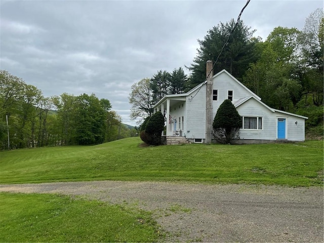 1217 County Highway 34, Westford, NY 12155 - view of home's exterior with a yard and a chimney