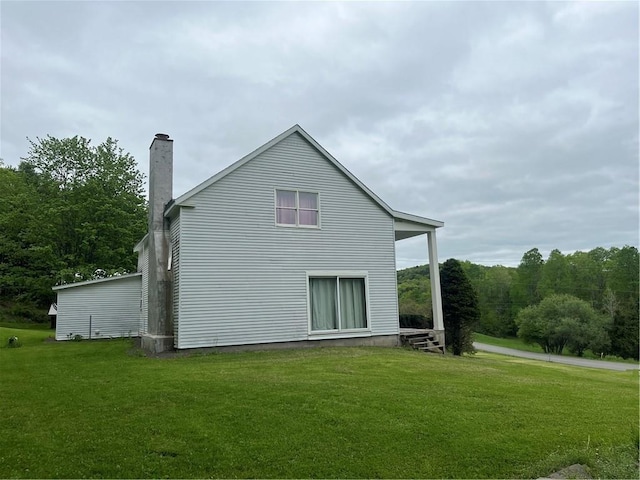 1217 County Highway 34, Westford, NY 12155 - back of house featuring a yard and a chimney
