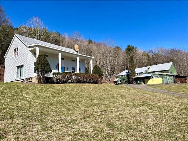 1217 County Highway 34, Westford, NY 12155 - view of front of house with a chimney and a front yard