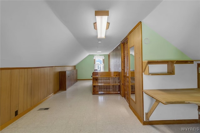 438 Zimmerman Blvd, Tonawanda-Town, NY 14223 - additional living space with wood walls, tile patterned floors, and vaulted ceiling
