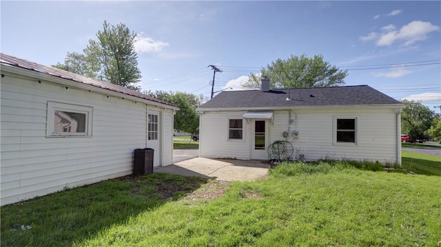15 Wycliffe Rd, Waterloo, NY 13165 - rear view of property with a yard, a patio, and a chimney