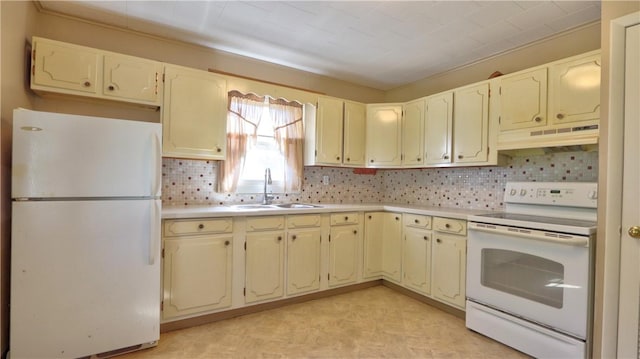 15 Wycliffe Rd, Waterloo, NY 13165 - kitchen featuring white appliances, under cabinet range hood, a sink, light countertops, and backsplash