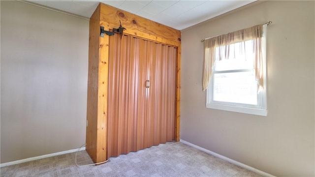 15 Wycliffe Rd, Waterloo, NY 13165 - unfurnished bedroom with carpet floors, baseboards, and a closet