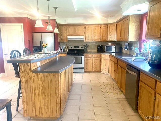 80 Sunnydale Ave, Wellsville, NY 14895 - kitchen with appliances with stainless steel finishes, under cabinet range hood, a kitchen island, backsplash, and light tile patterned flooring