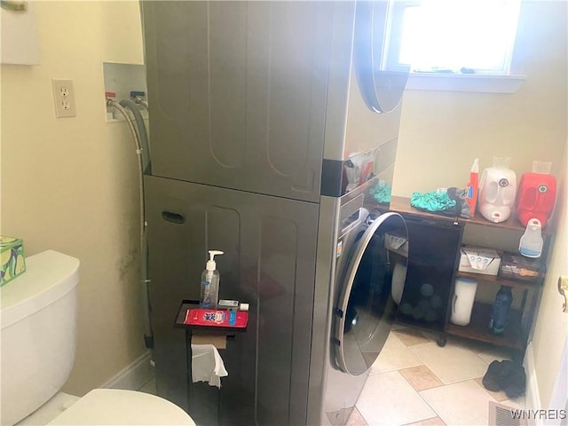 80 Sunnydale Ave, Wellsville, NY 14895 - laundry area with stacked washer / drying machine and light tile patterned floors