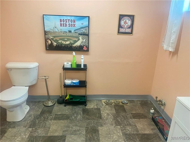 80 Sunnydale Ave, Wellsville, NY 14895 - bathroom featuring stone finish flooring and toilet