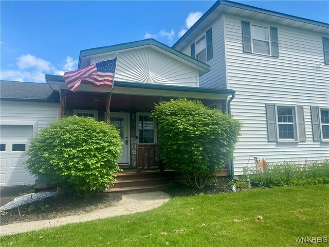 80 Sunnydale Ave, Wellsville, NY 14895 - view of front of property featuring a front yard, a porch, and an attached garage