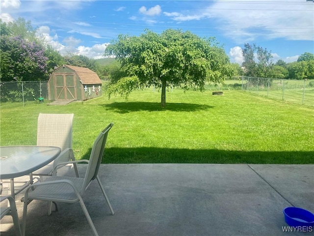 80 Sunnydale Ave, Wellsville, NY 14895 - fenced backyard featuring a patio area and a storage shed
