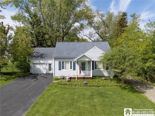 10595 Linwood Dr, Dunkirk-Town, NY 14048 - view of front of house featuring an attached garage, driveway, a front lawn, a shingled roof, and a chimney