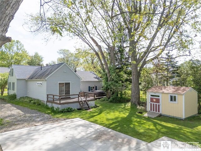 10595 Linwood Dr, Dunkirk-Town, NY 14048 - view of green lawn featuring a wooden deck and a patio area