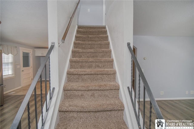 10595 Linwood Dr, Dunkirk-Town, NY 14048 - stairway with wood finished floors and baseboards