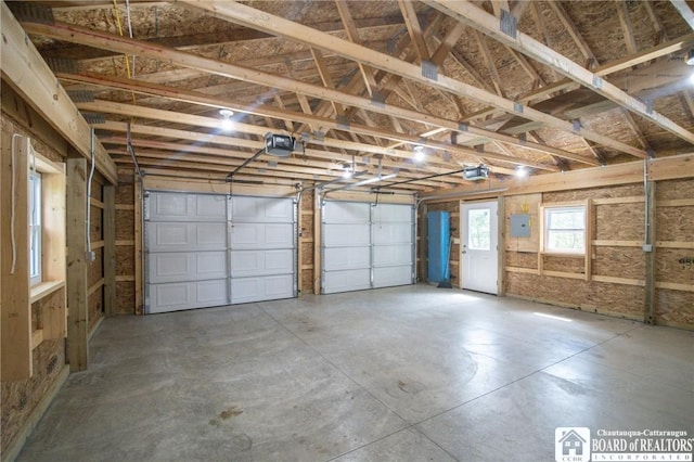 10595 Linwood Dr, Dunkirk-Town, NY 14048 - garage featuring a garage door opener