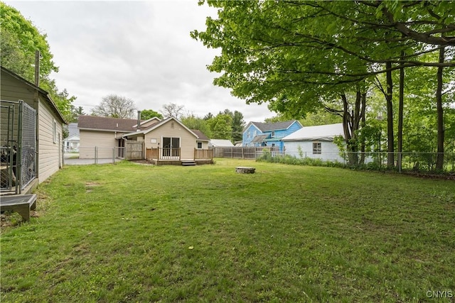 152 Leray St, Le Ray, NY 13612 - view of yard with a wooden deck and a fire pit