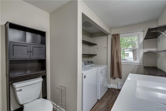 152 Leray St, Le Ray, NY 13612 - laundry room with washing machine and dryer, dark wood-style flooring, and baseboards