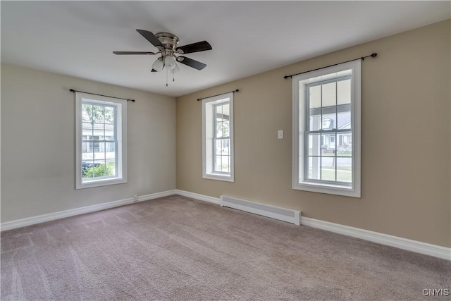 152 Leray St, Le Ray, NY 13612 - carpeted spare room featuring a baseboard heating unit, baseboards, and a ceiling fan